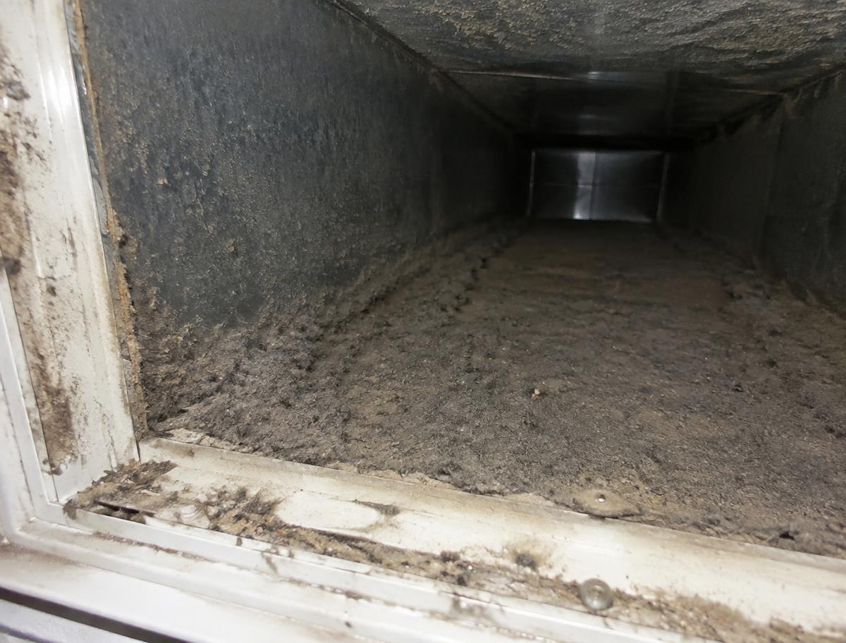 Dusty air duct before cleaning